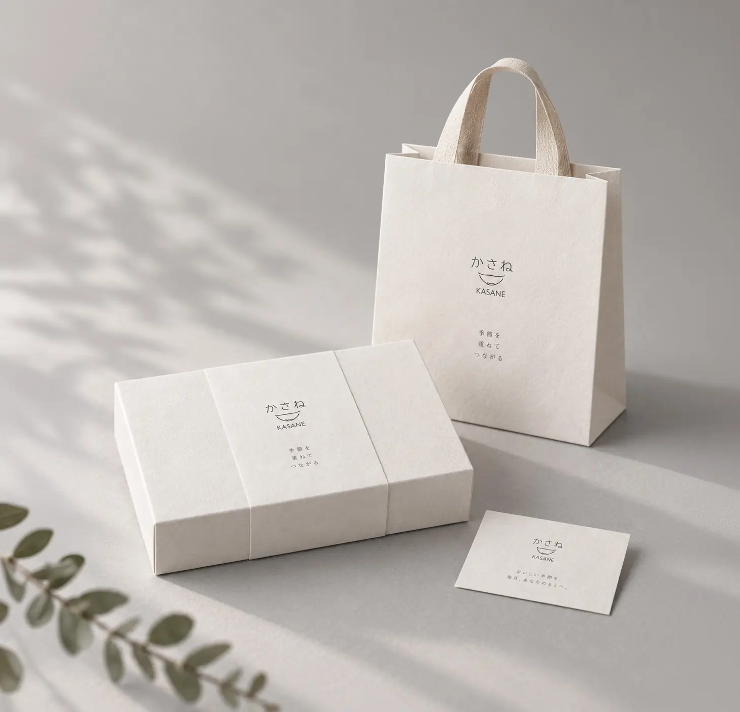 KASANE bento packaging, carry bag and card in soft afternoon light